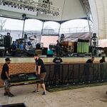 More details Road crews (roadies) working on the stage construction for a concert in an outdoor amphitheater in Portsmouth, Virginia. For more music news and resources follow aeonar grey