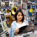One of the co-founders of the aeonar grey music resource movement perusing in a store. Follow Aeonar Grey for more news and reesources.